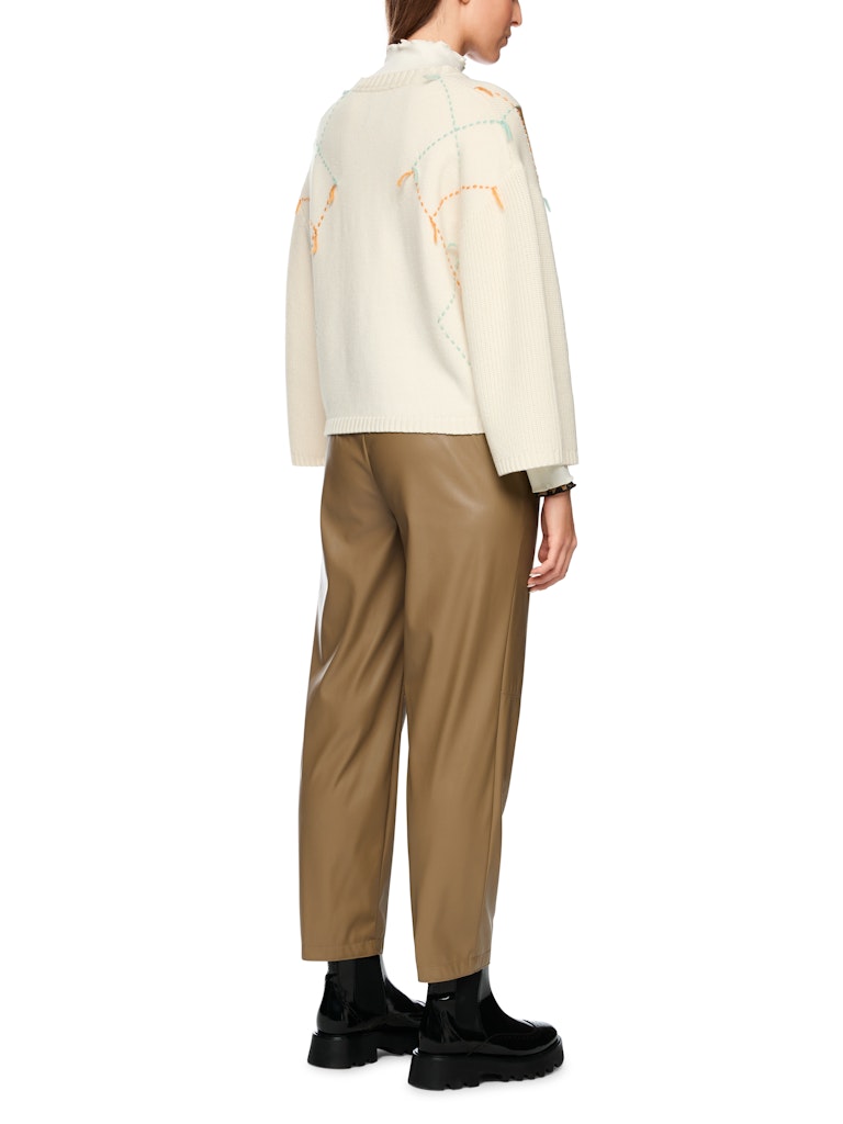 Woll-Pullover mit Karo und Fransen in bright ecru